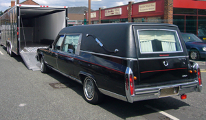Cadillac Hearse being loaded for a funeral director